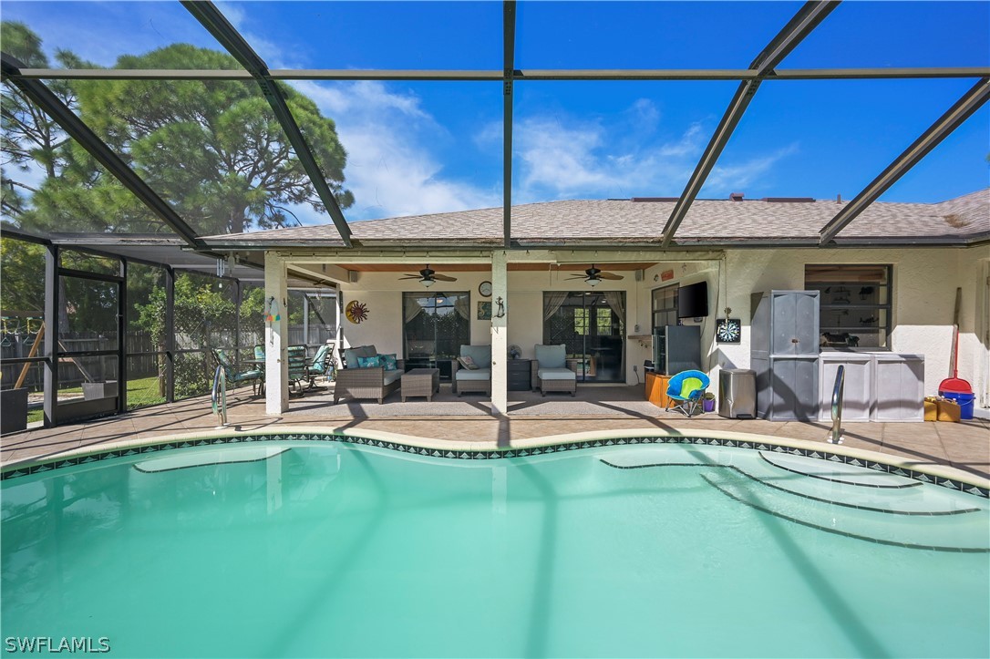 17413 Butler Road Fort Myers, FL 33967 - Photo 3 of 33 a view of a swimming pool with a patio