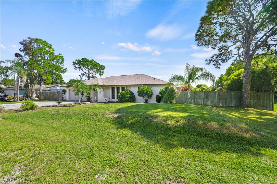 17413 Butler Road Fort Myers, FL 33967 - Photo 32 of 33 a front view of a house with garden