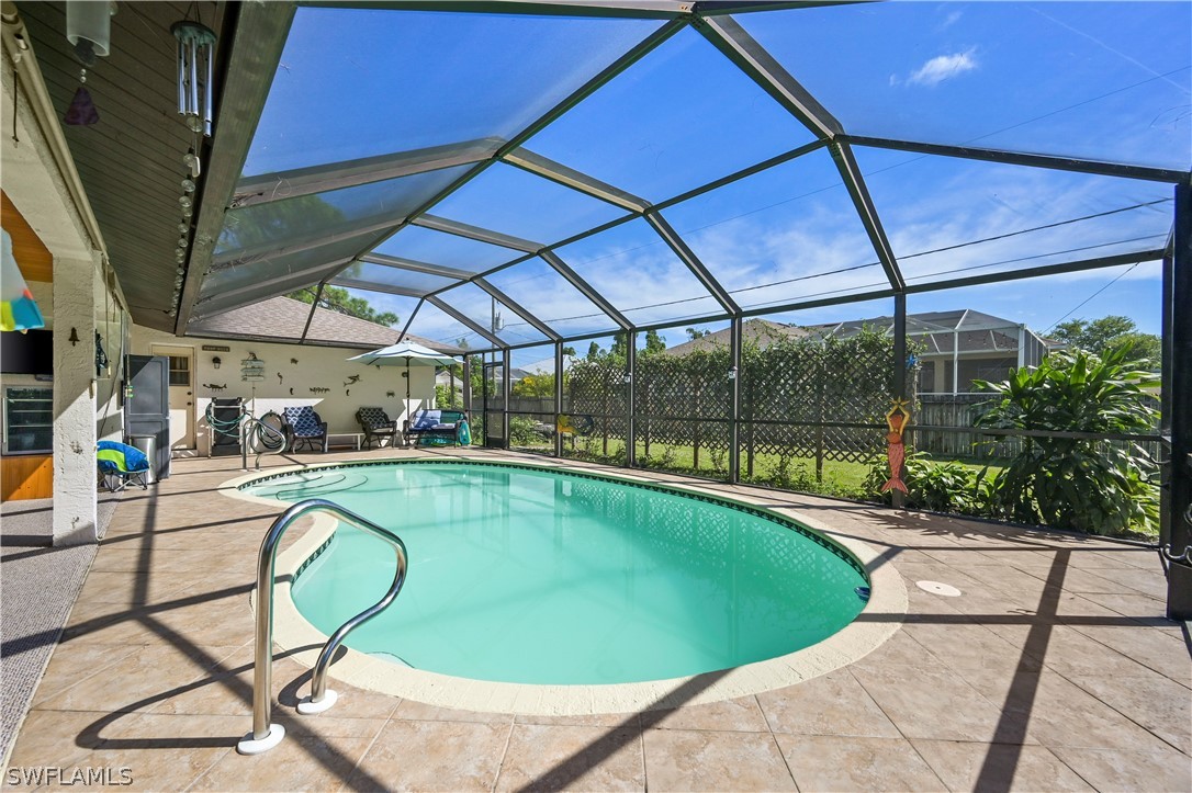 17413 Butler Road Fort Myers, FL 33967 - Photo 4 of 33 a view of a swimming pool with a patio