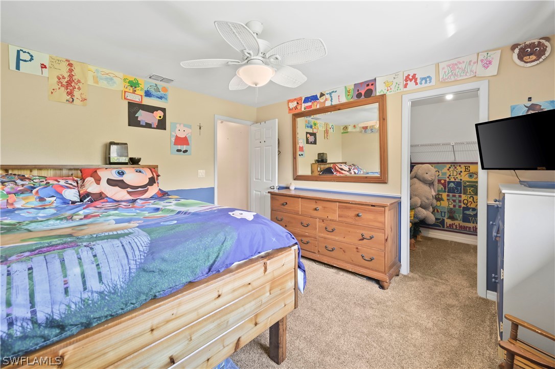 17413 Butler Road Fort Myers, FL 33967 - Photo 6 of 33 a bedroom with a bed and furniture