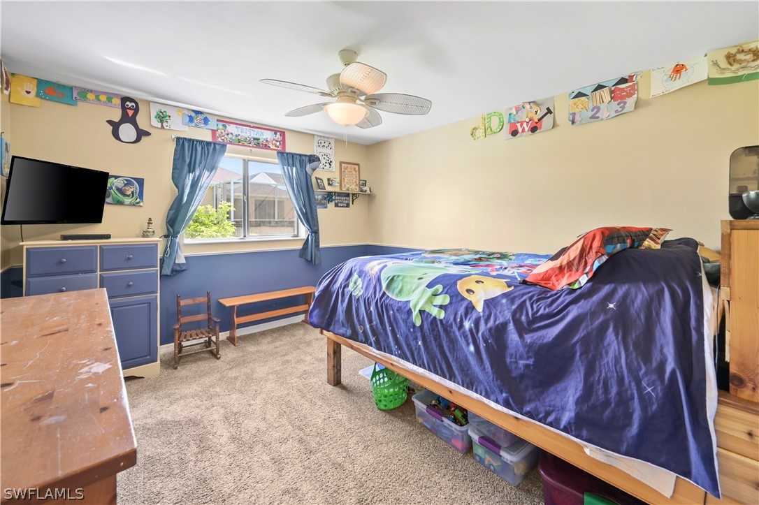 17413 Butler Road Fort Myers, FL 33967 - Photo 7 of 33 a bedroom with a bed and a flat screen tv