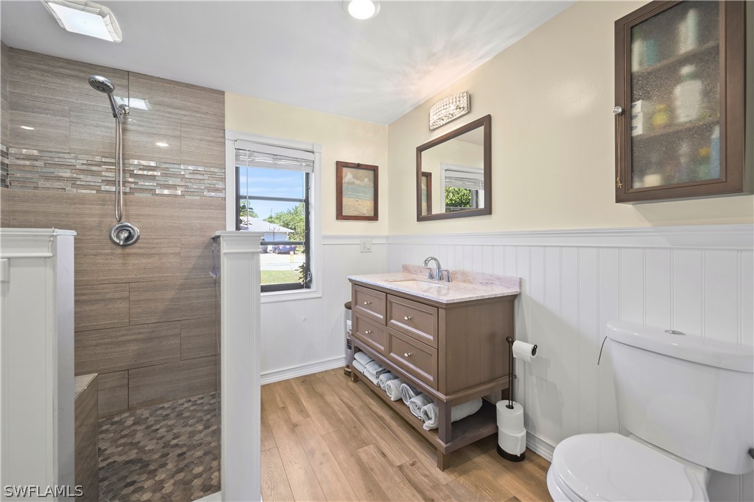 17413 Butler Road Fort Myers, FL 33967 - Photo 10 of 33 a bathroom with a sink mirror vanity and toilet