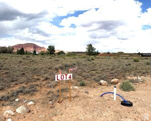 925 West 100 South, Unit 4 Torrey, UT 84775 - Photo 2 of 5 Expansive open land featuring natural desert vegetation, scattered rock elements, and a visible water hookup