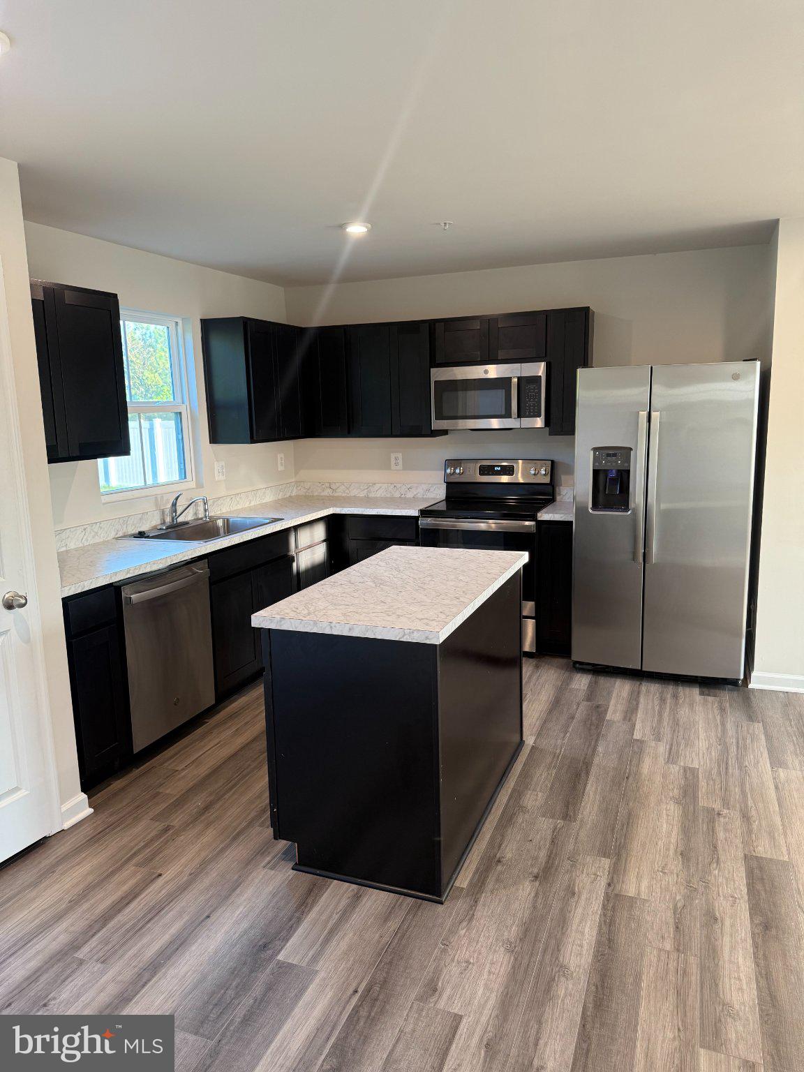 110 Mariners Way Cambridge, MD 21613 - Photo 6 of 22 Modern kitchen with sleek finishes.