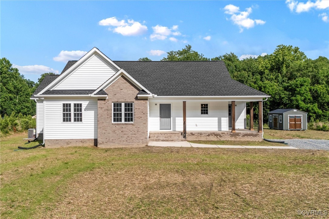 699 Trimmers Shop Road West Point, VA 23181 - Photo 1 of 27 View of front of house featuring a shed, a porch,