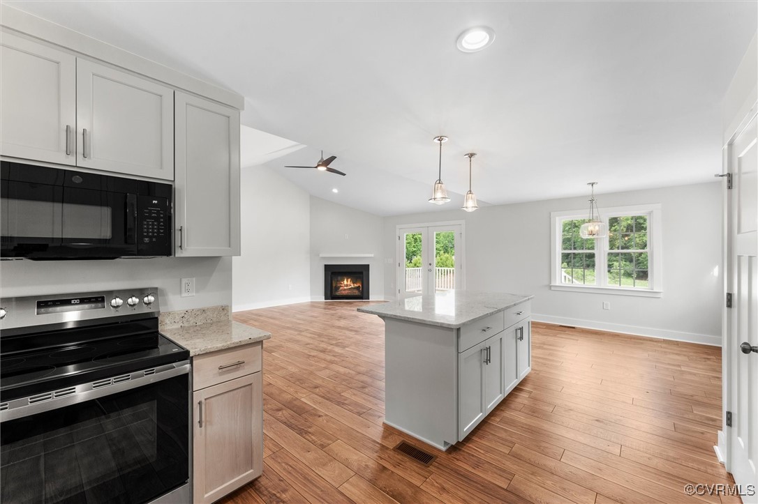 699 Trimmers Shop Road West Point, VA 23181 - Photo 12 of 27 Kitchen with electric stove, black microwave, a li