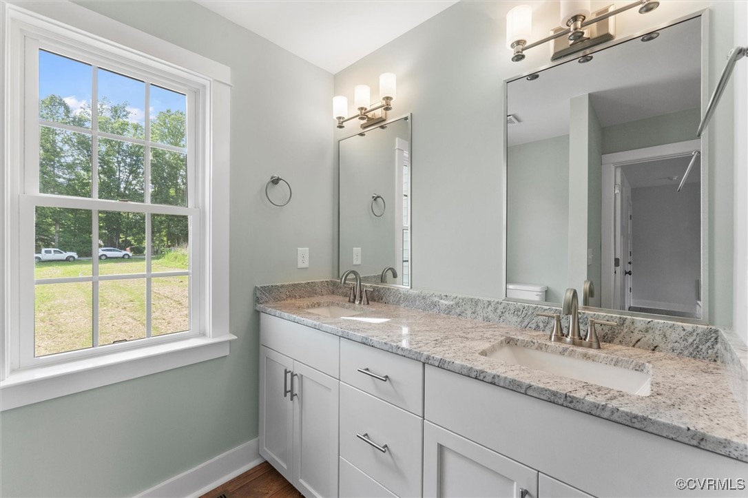 699 Trimmers Shop Road West Point, VA 23181 - Photo 24 of 27 Full bath featuring double vanity and wood finishe