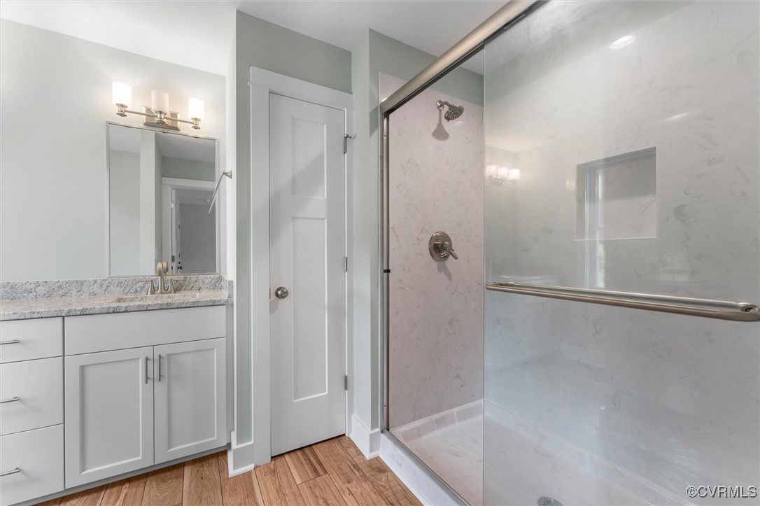 699 Trimmers Shop Road West Point, VA 23181 - Photo 25 of 27 Full bath with a shower stall, vanity, and wood fi