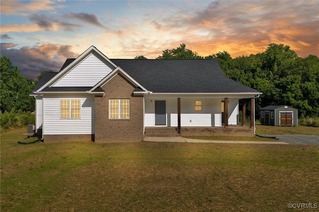 699 Trimmers Shop Road West Point, VA 23181 - Photo 27 of 27 View of front of home featuring a shed, a lawn, a