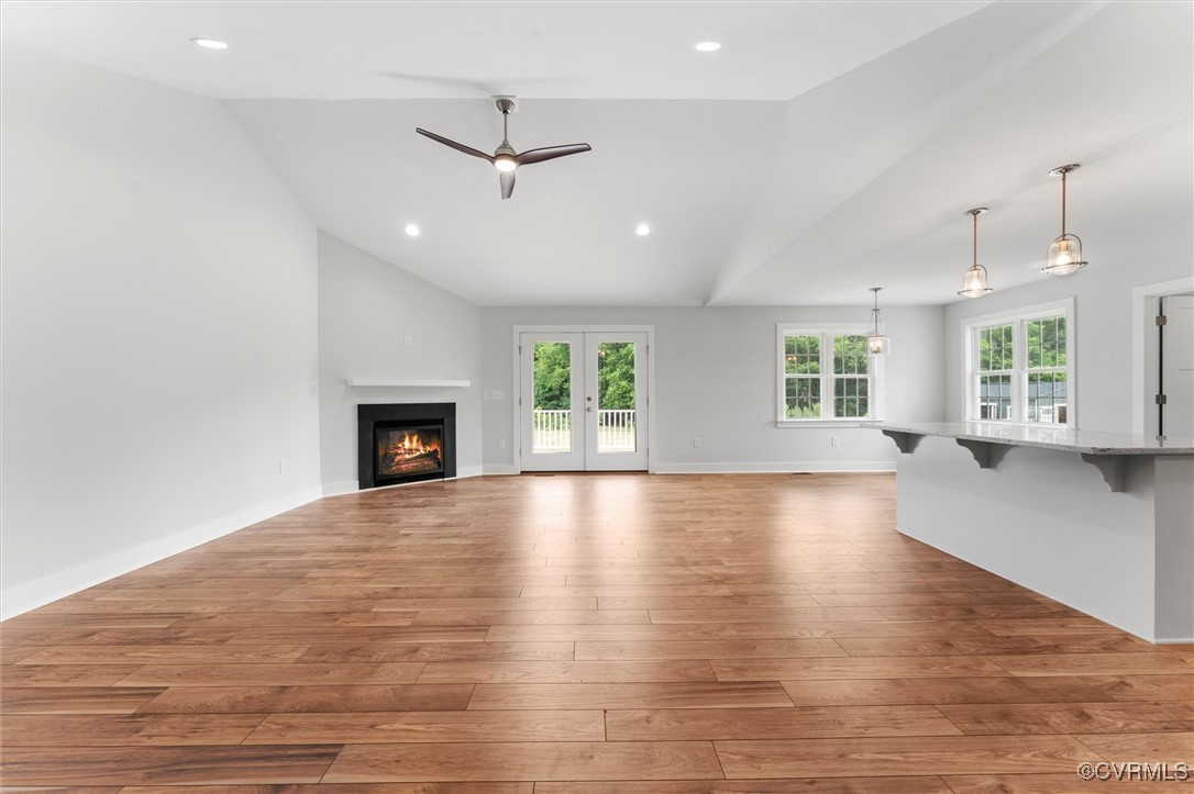 699 Trimmers Shop Road West Point, VA 23181 - Photo 7 of 27 Unfurnished living room with vaulted ceiling, ligh