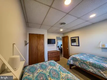 a bedroom with bed and window