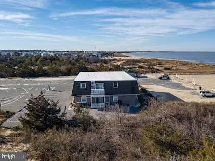 a aerial view of a house with a yard