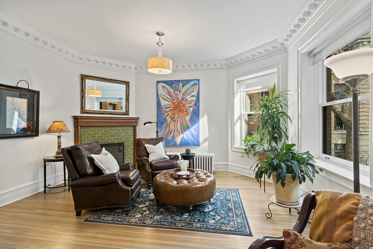 670 West Irving Park Road, Unit G6 Chicago, IL 60613 - Photo 13 of 38 a living room with furniture and a fireplace