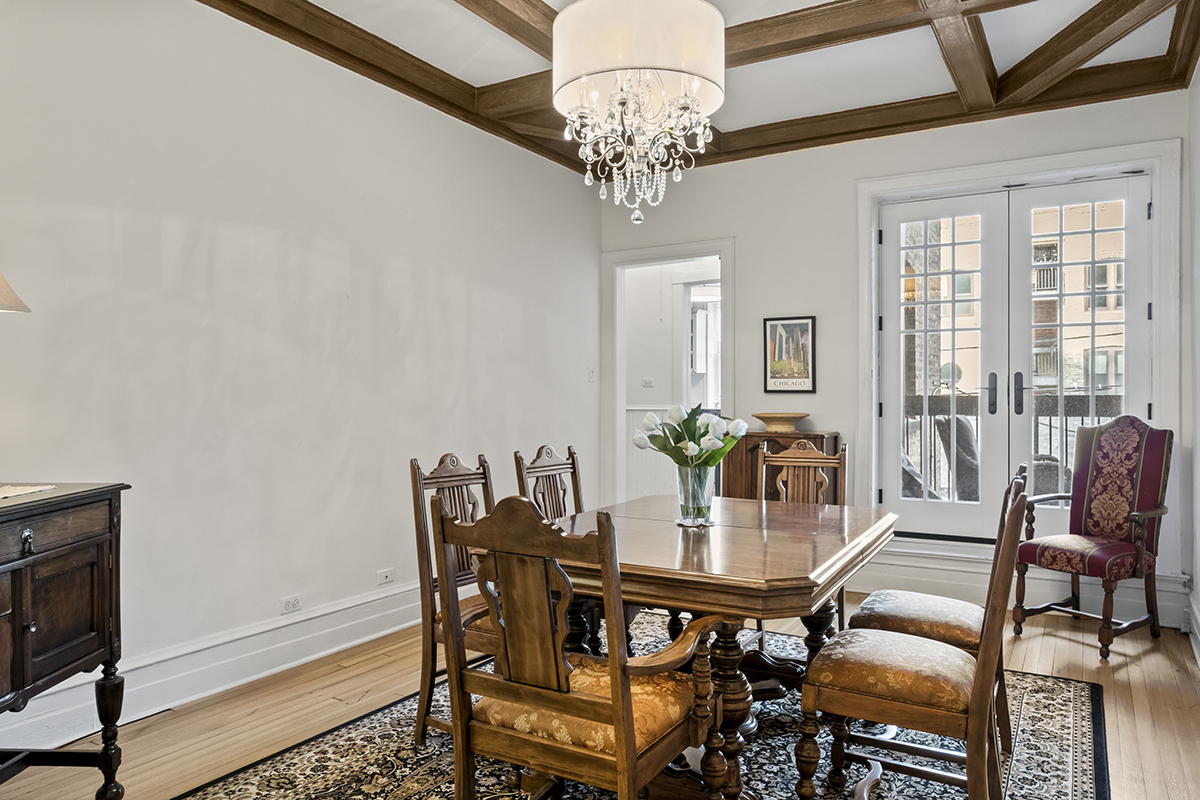 670 West Irving Park Road, Unit G6 Chicago, IL 60613 - Photo 18 of 38 a view of a dining room with furniture and chandelier