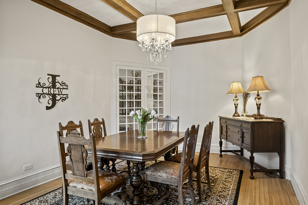 670 West Irving Park Road, Unit G6 Chicago, IL 60613 - Photo 19 of 38 a view of a dining room with furniture and chandelier