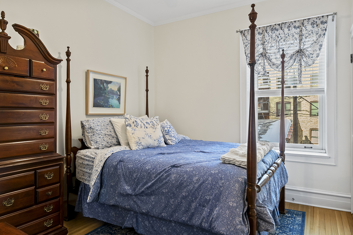 670 West Irving Park Road, Unit G6 Chicago, IL 60613 - Photo 25 of 38 a bedroom with a bed and a window