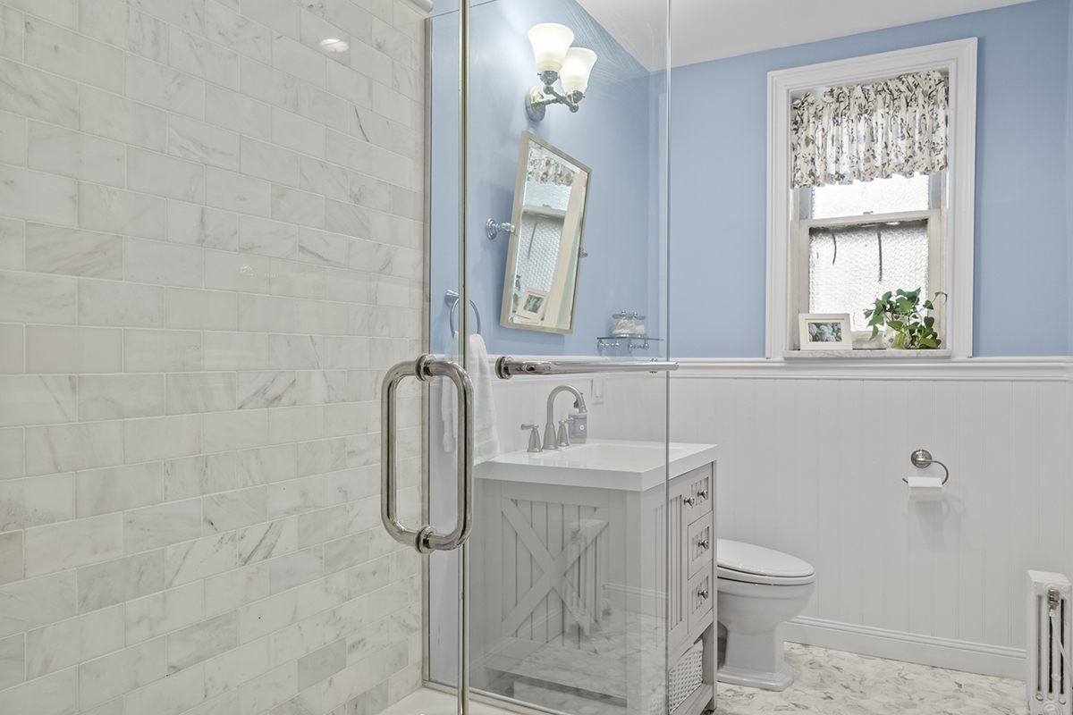670 West Irving Park Road, Unit G6 Chicago, IL 60613 - Photo 27 of 38 a bathroom with a toilet sink and shower
