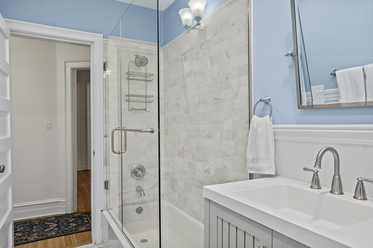 670 West Irving Park Road, Unit G6 Chicago, IL 60613 - Photo 28 of 38 a bathroom with a sink and a mirror