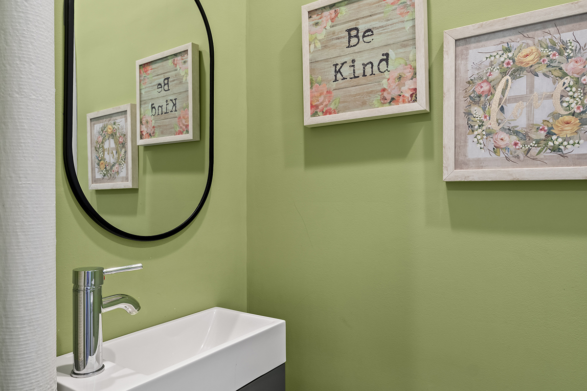 670 West Irving Park Road, Unit G6 Chicago, IL 60613 - Photo 31 of 38 a bathroom with a sink and a mirror