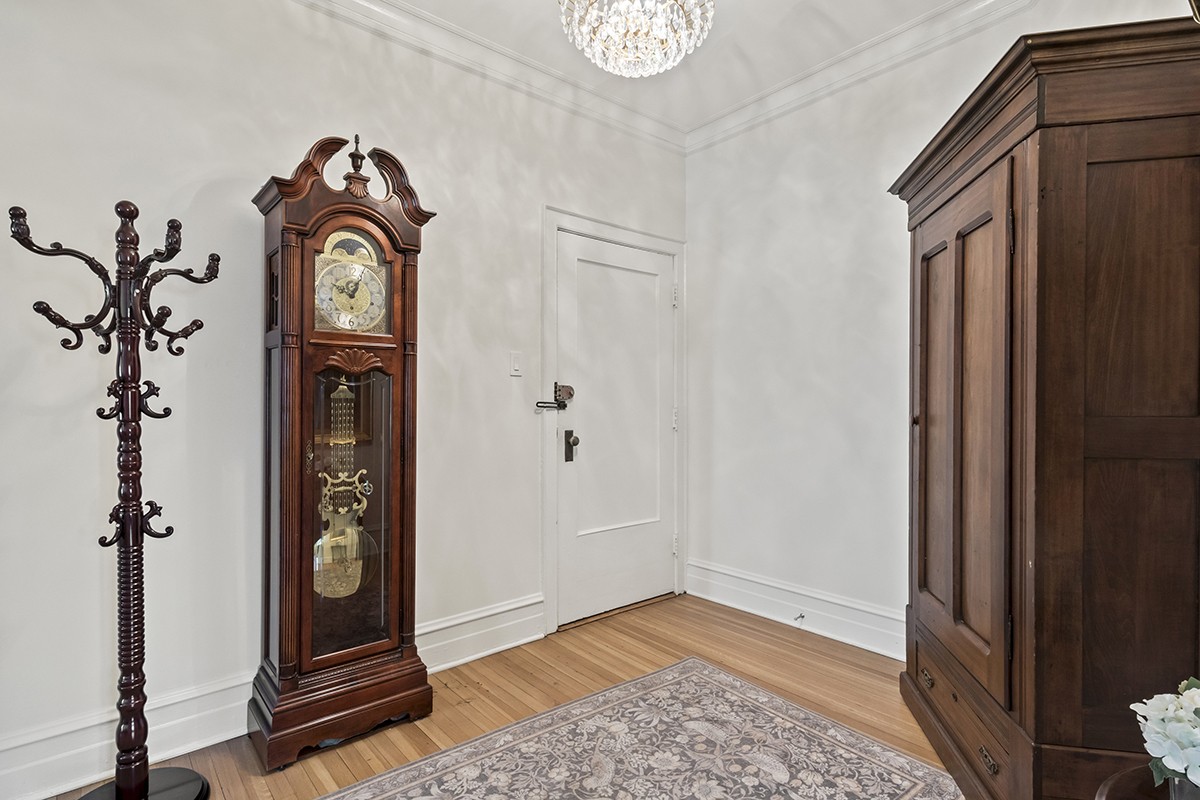 670 West Irving Park Road, Unit G6 Chicago, IL 60613 - Photo 9 of 38 a view of a hallway with entryway wooden floor and front door