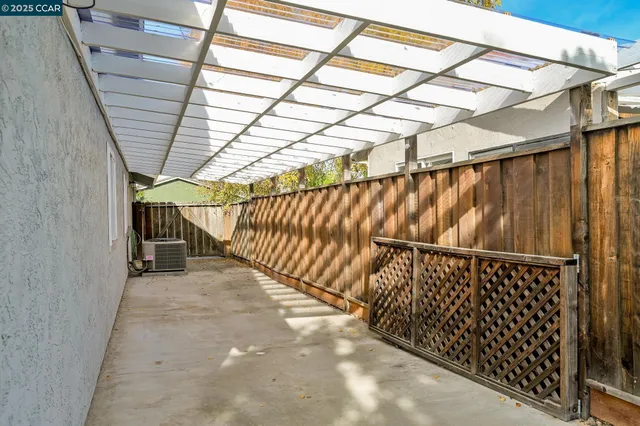 a view of outdoor space with wooden deck and city view