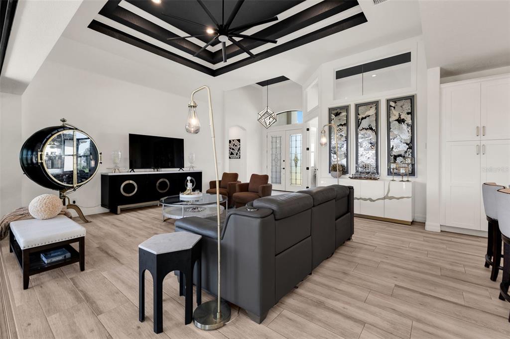 48 Master Drive Placida, FL 33946 - Photo 11 of 61 a living room with furniture a fireplace and a flat screen tv