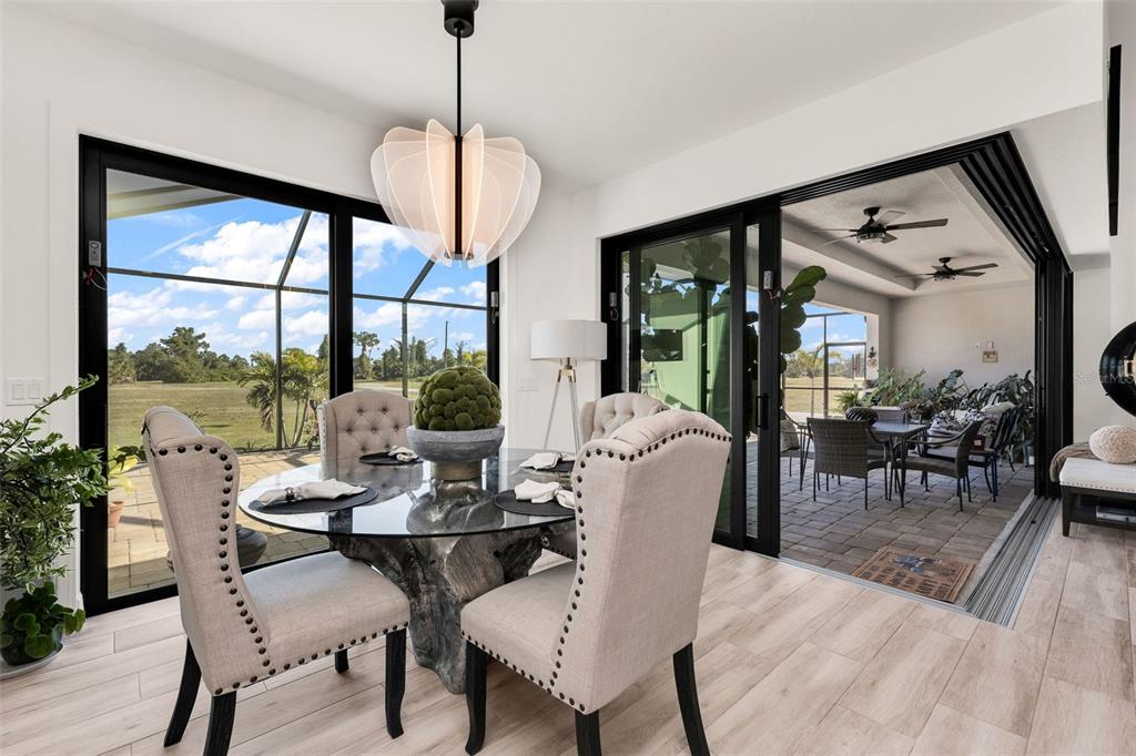 48 Master Drive Placida, FL 33946 - Photo 21 of 61 a dining room with furniture window and wooden floor