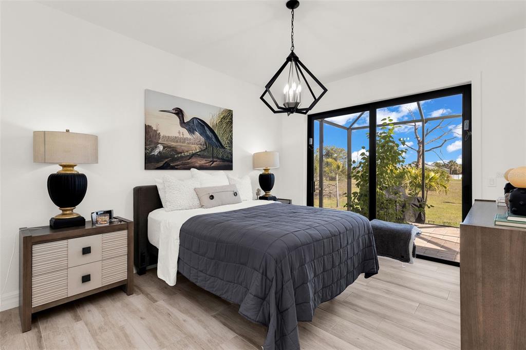 48 Master Drive Placida, FL 33946 - Photo 24 of 61 a bedroom with a large bed and a window