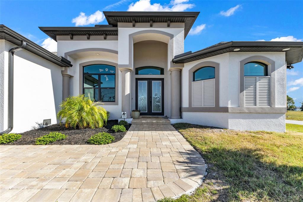 48 Master Drive Placida, FL 33946 - Photo 3 of 61 a front view of a house with garden