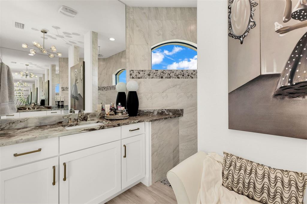 48 Master Drive Placida, FL 33946 - Photo 31 of 61 a spacious bathroom with a sink double vanity granite and a mirror