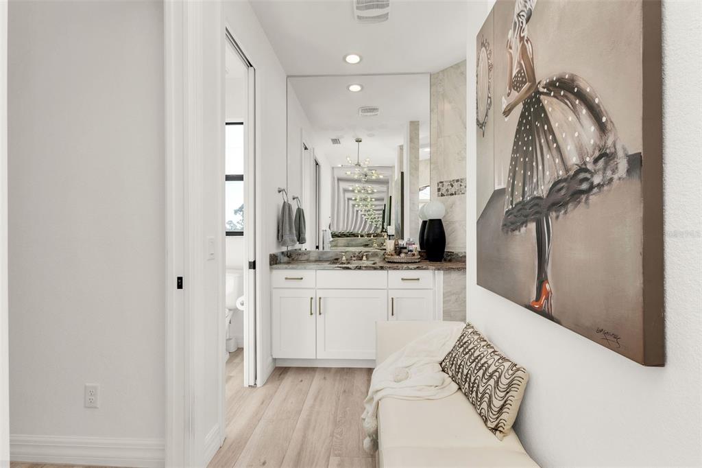 48 Master Drive Placida, FL 33946 - Photo 33 of 61 a living room with stainless steel appliances kitchen island granite countertop furniture and a wooden floor