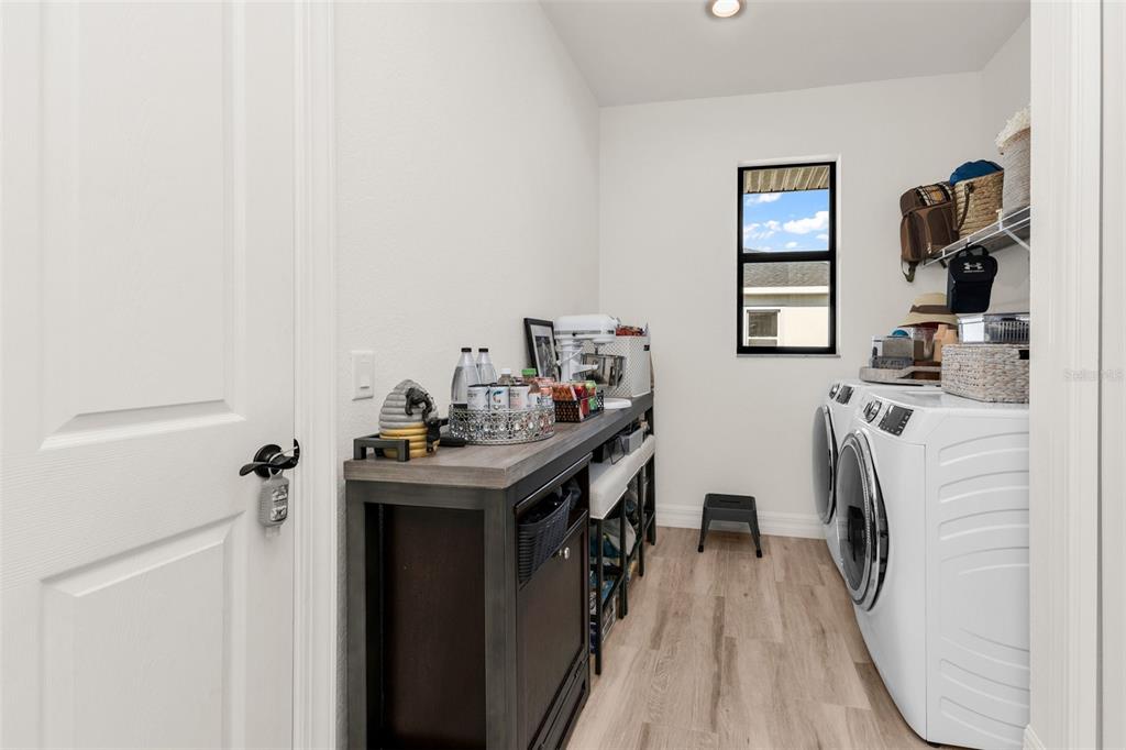 48 Master Drive Placida, FL 33946 - Photo 35 of 61 a utility room with closet a washer and dryer