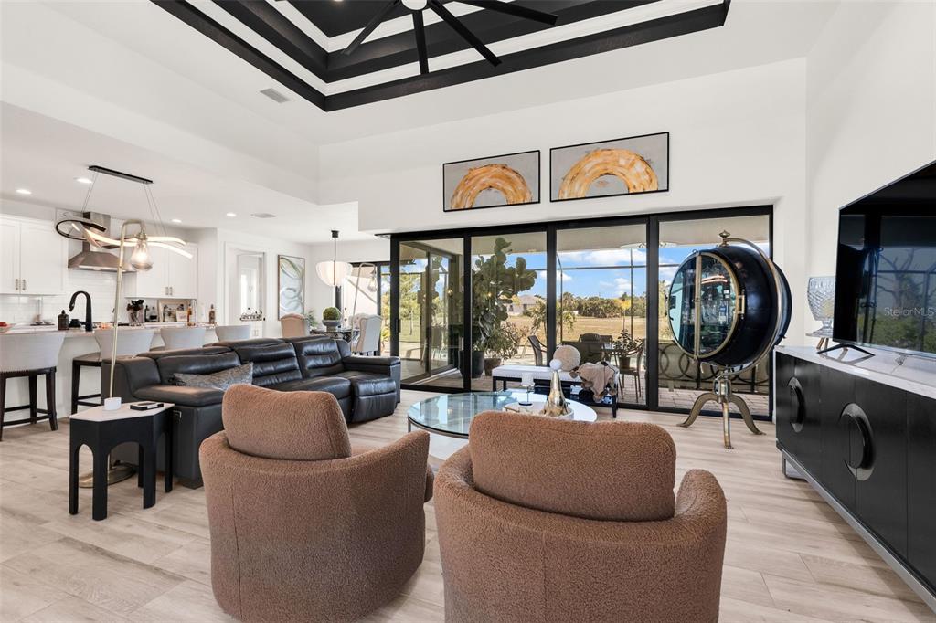 48 Master Drive Placida, FL 33946 - Photo 37 of 61 a living room with lots of furniture and a large window