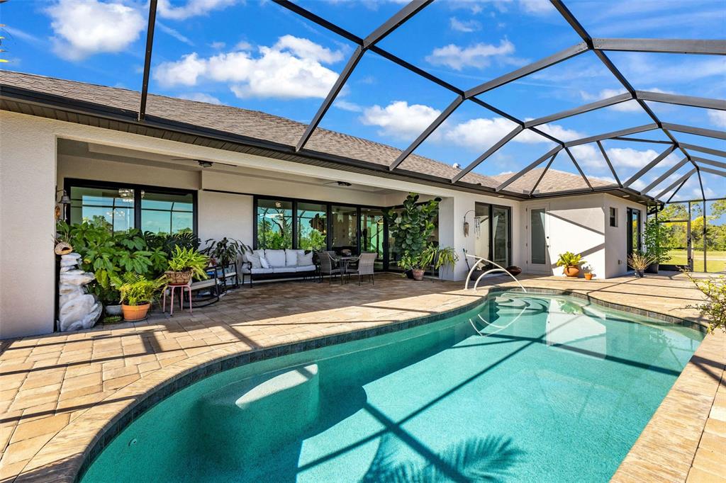 48 Master Drive Placida, FL 33946 - Photo 45 of 61 a view of a swimming pool with a patio