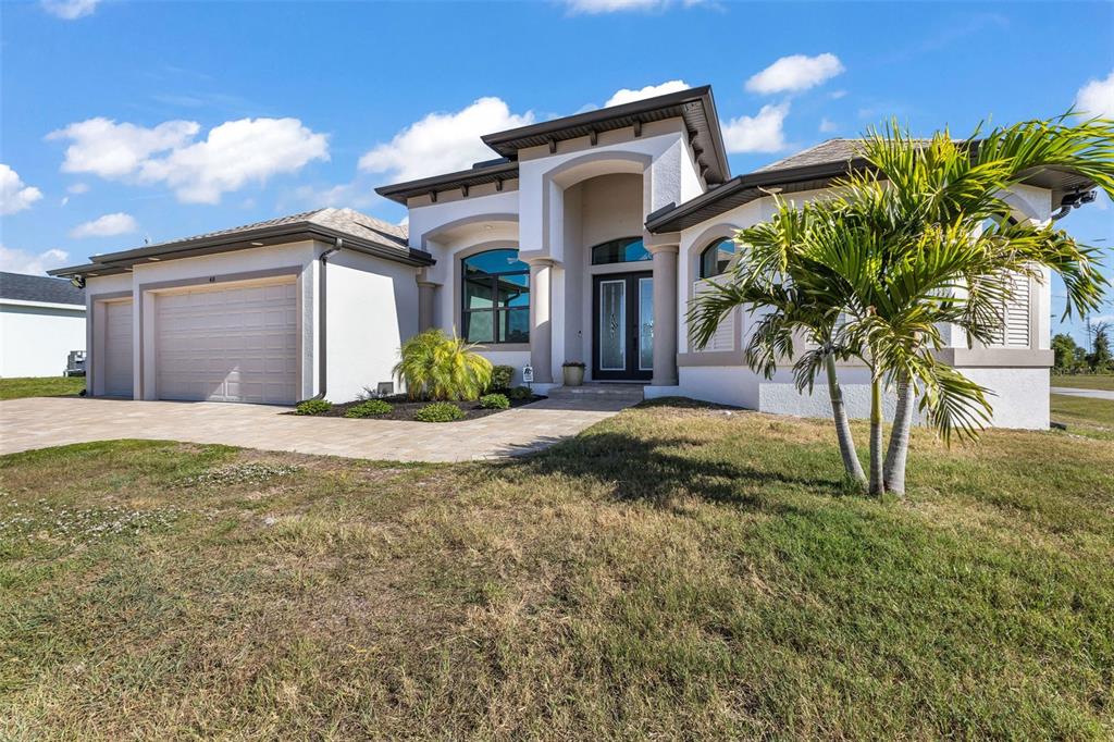 48 Master Drive Placida, FL 33946 - Photo 49 of 61 a front view of a house with a yard