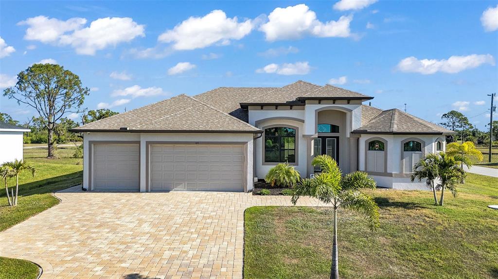 48 Master Drive Placida, FL 33946 - Photo 51 of 61 a front view of a house with garden