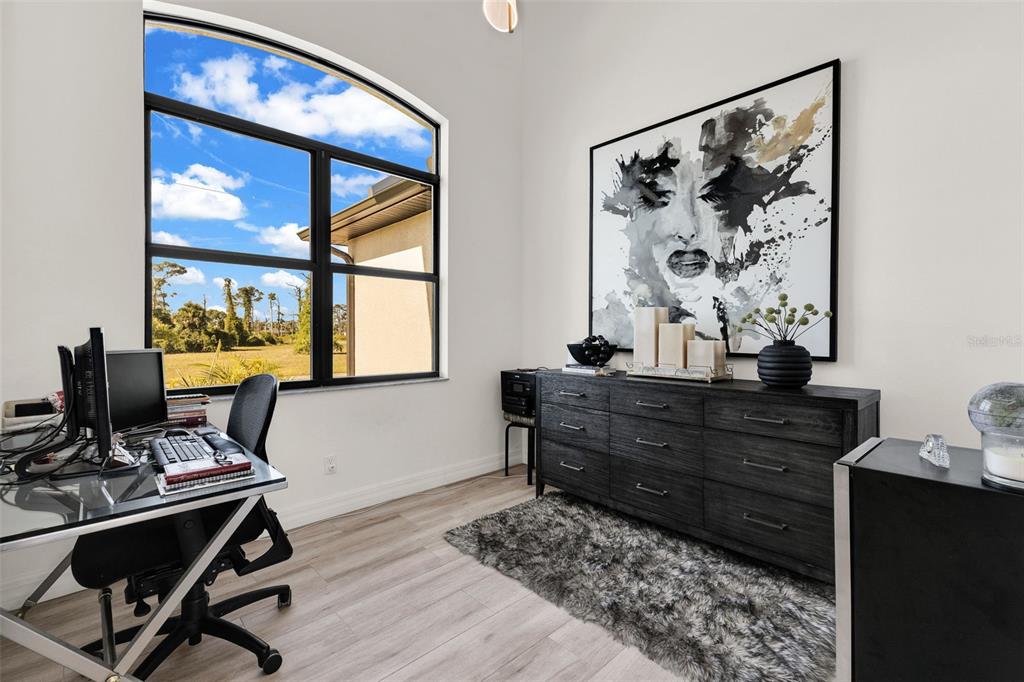 48 Master Drive Placida, FL 33946 - Photo 6 of 61 a room with a window and painting on the wall