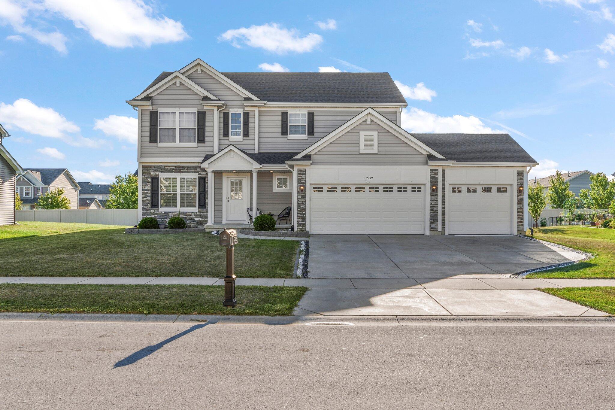 11539 Georgia Place Crown Point, IN 46307 - Photo 1 of 37 front view of a house with a yard