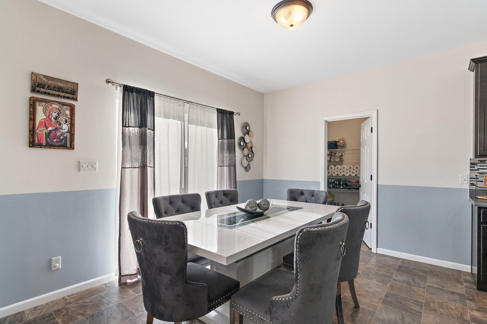 11539 Georgia Place Crown Point, IN 46307 - Photo 11 of 37 a dining room with furniture and window