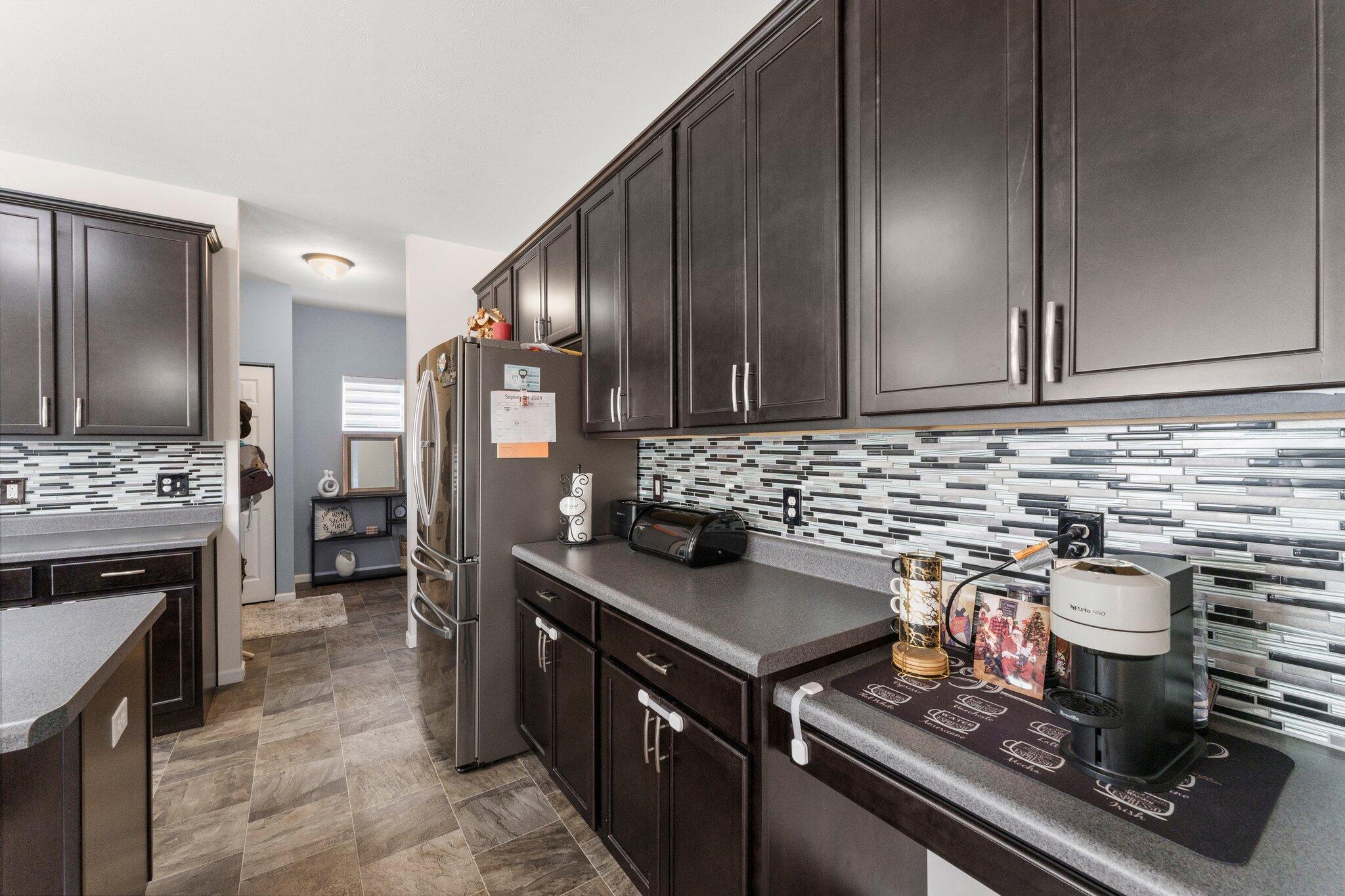 11539 Georgia Place Crown Point, IN 46307 - Photo 14 of 37 a kitchen with a stove and a refrigerator