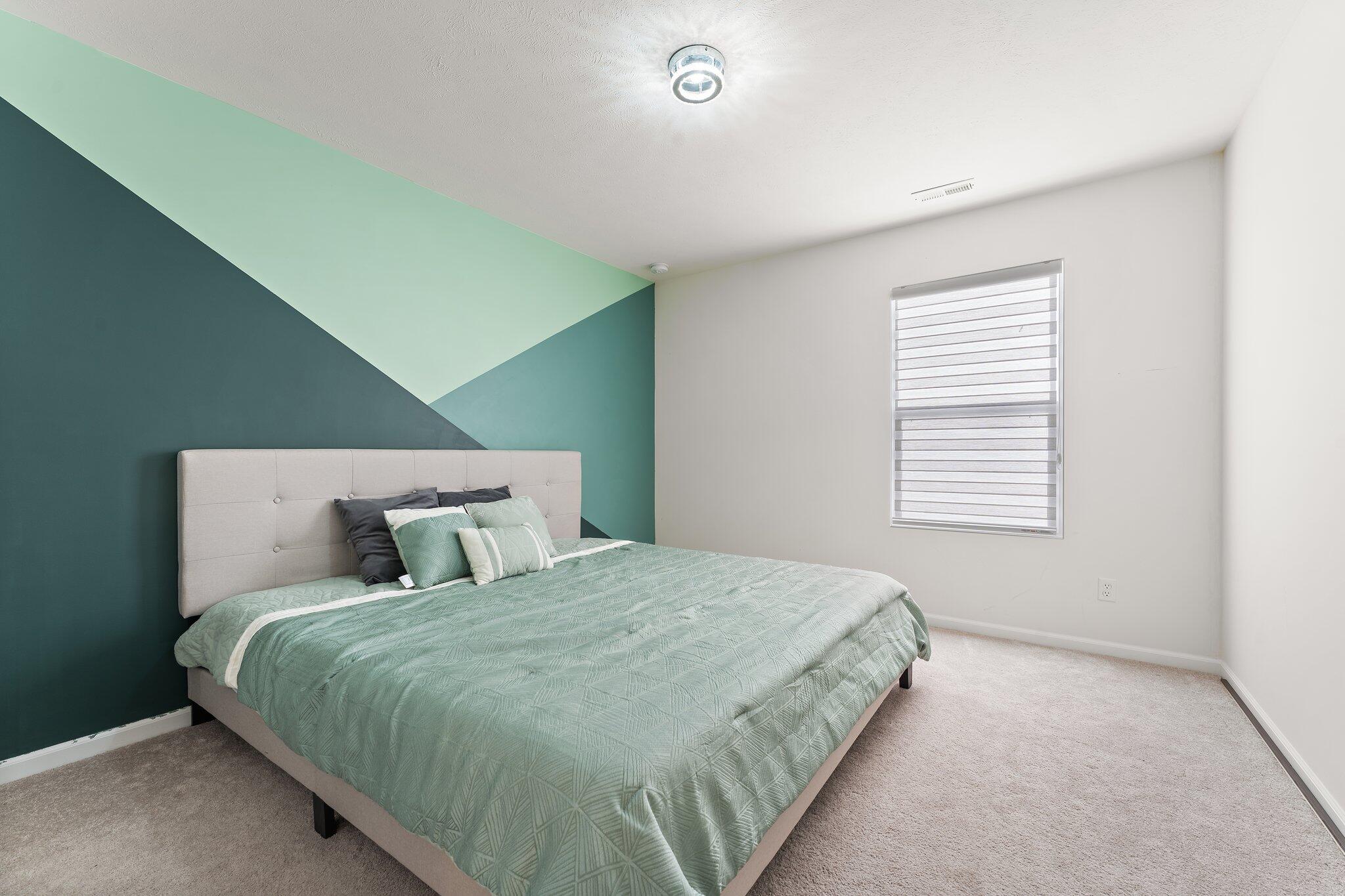 11539 Georgia Place Crown Point, IN 46307 - Photo 20 of 37 a bedroom with a bed and a window