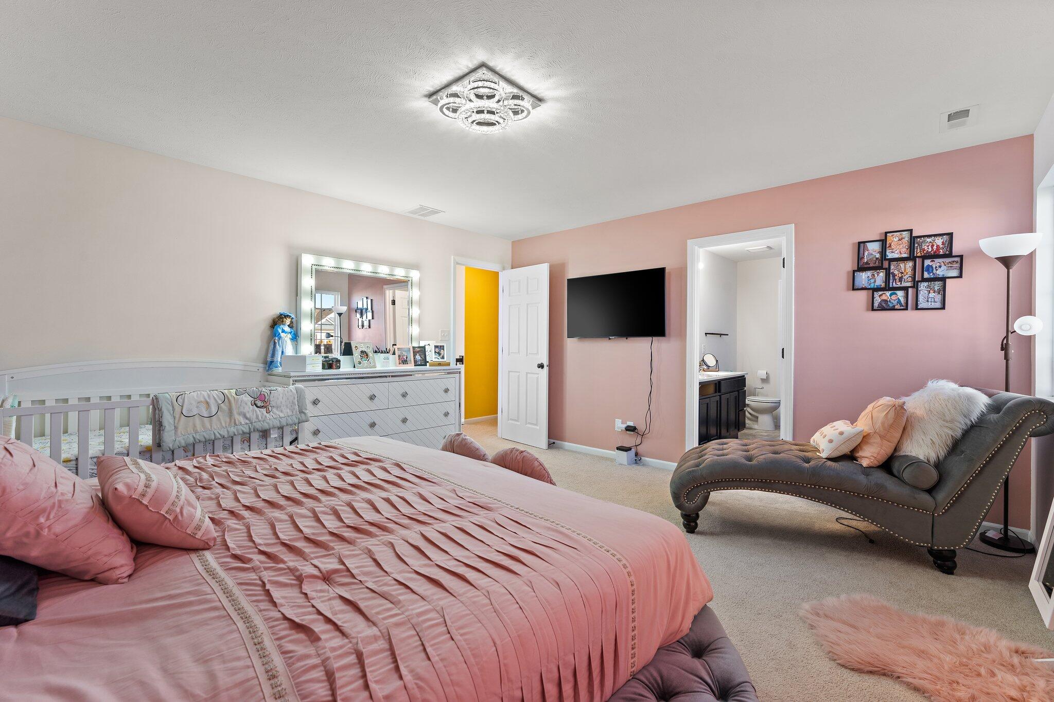 11539 Georgia Place Crown Point, IN 46307 - Photo 25 of 37 a bedroom with a bed couch and window