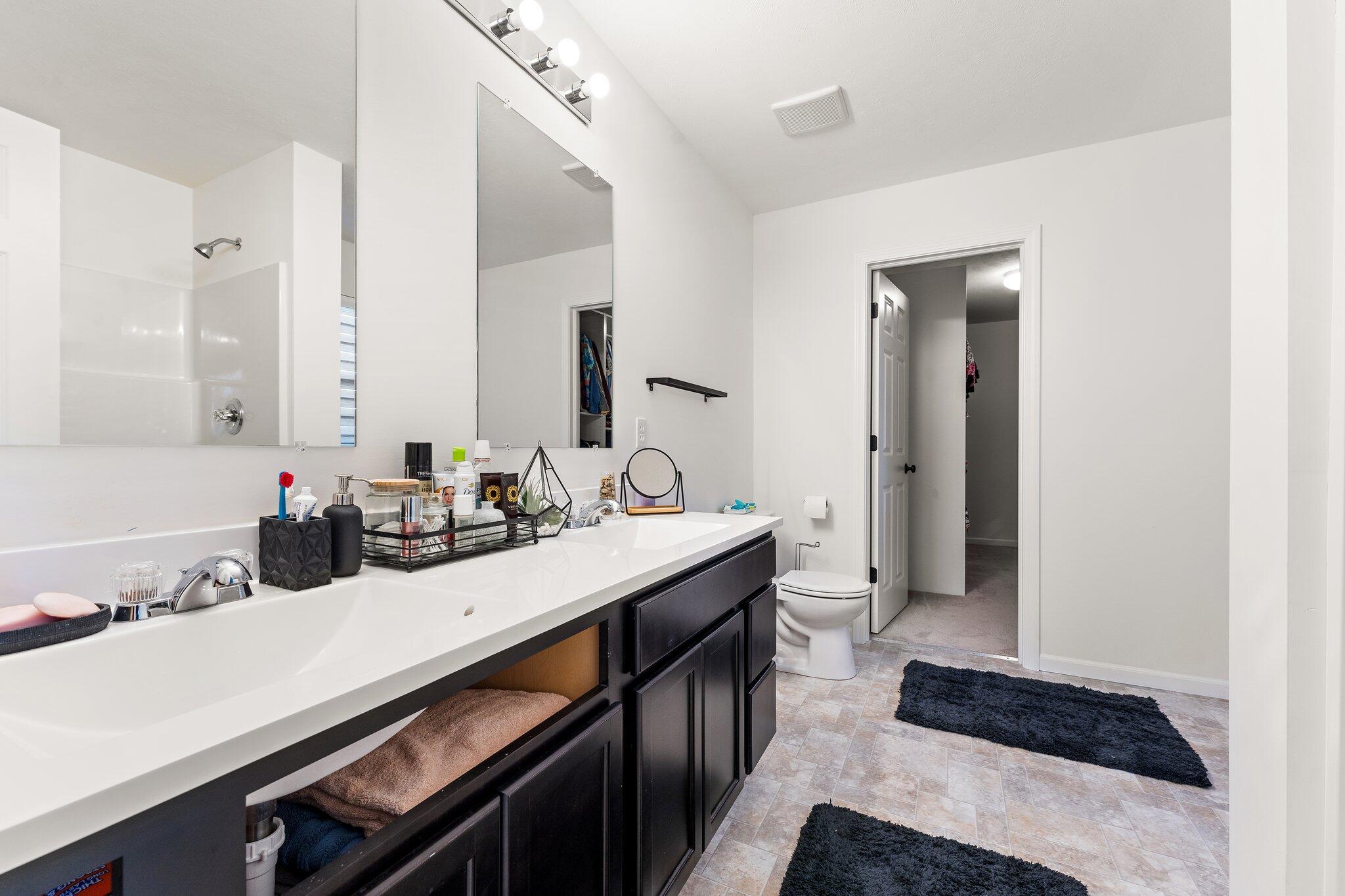 11539 Georgia Place Crown Point, IN 46307 - Photo 26 of 37 a bathroom with a sink and a mirror