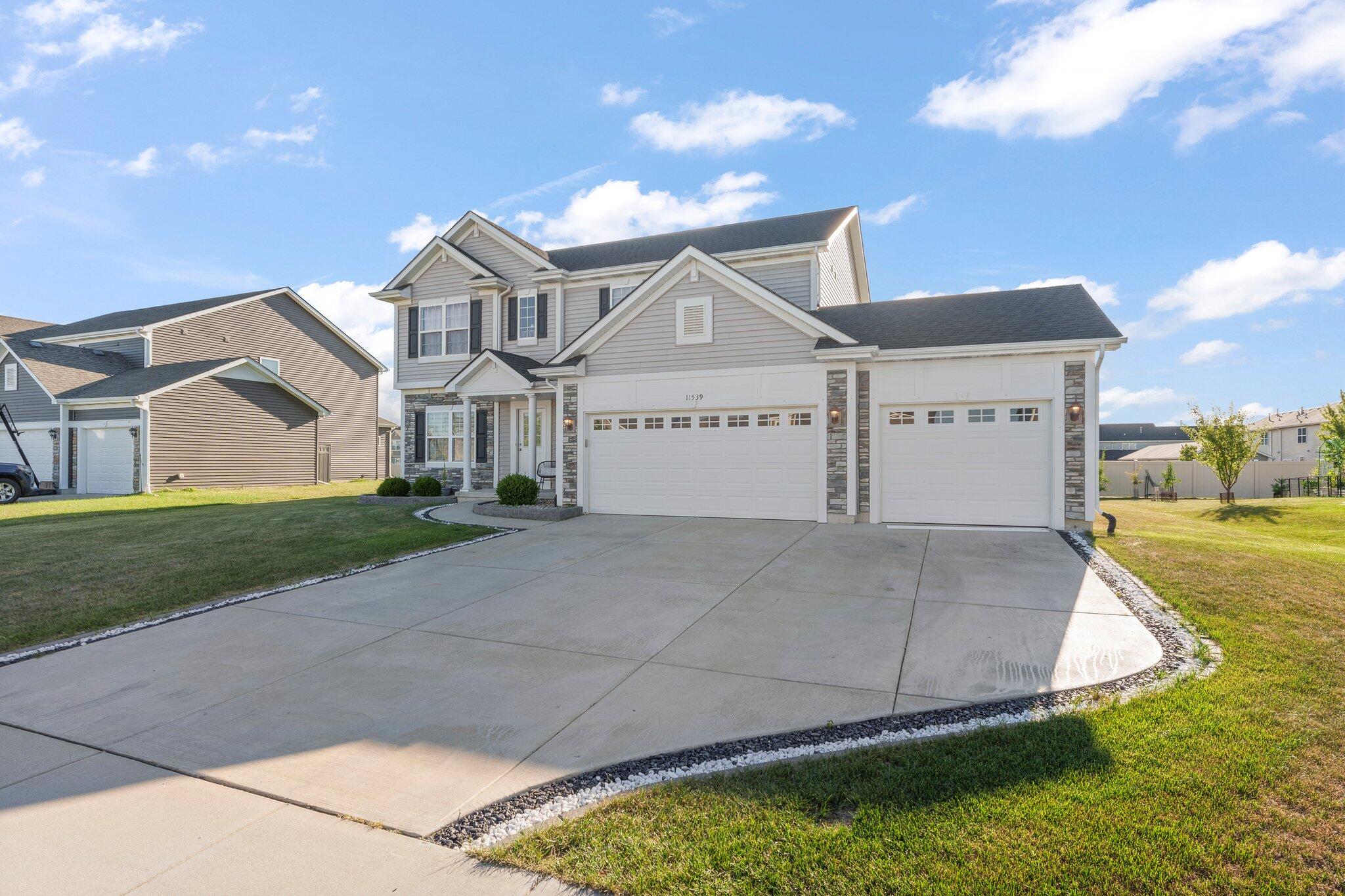 11539 Georgia Place Crown Point, IN 46307 - Photo 30 of 37 a view of a big house with a big yard and large trees
