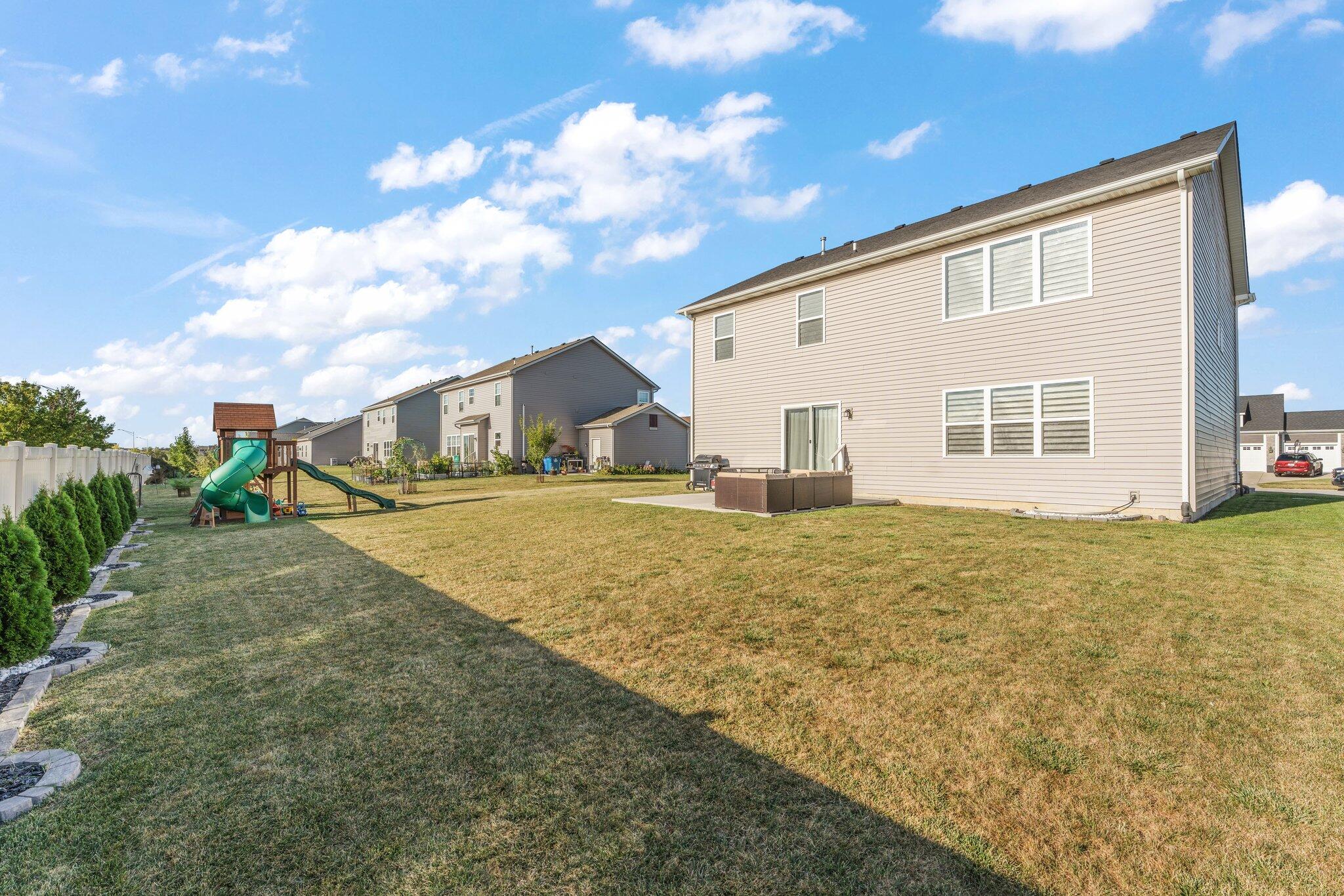 11539 Georgia Place Crown Point, IN 46307 - Photo 33 of 37 a front view of a house with a yard