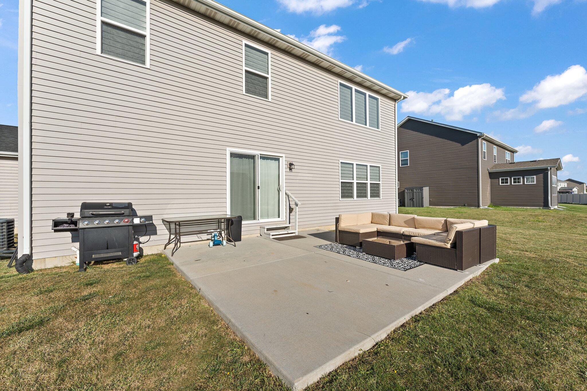 11539 Georgia Place Crown Point, IN 46307 - Photo 34 of 37 a backyard of a house with fire pit and couch