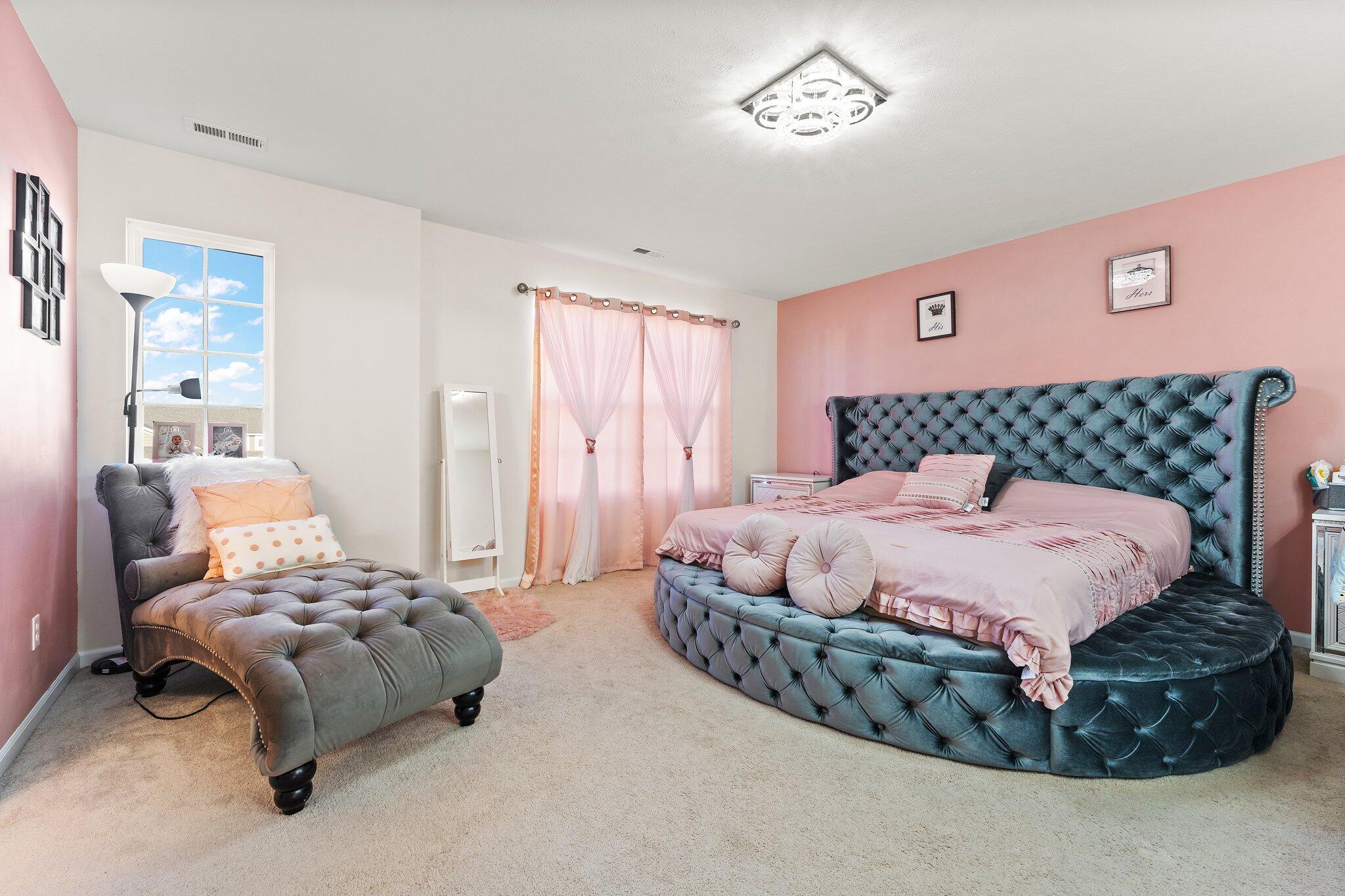 11539 Georgia Place Crown Point, IN 46307 - Photo 4 of 37 a bedroom with a bed and a couch