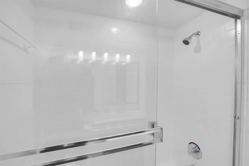 2500 Winding Creek Boulevard, Unit A104 Clearwater, FL 33761 - Photo 19 of 31 a bathroom with a shower