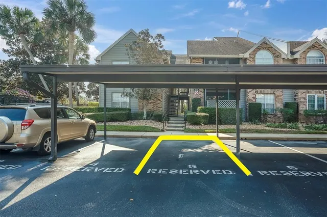 a view of swimming pool with a lounge chair and table