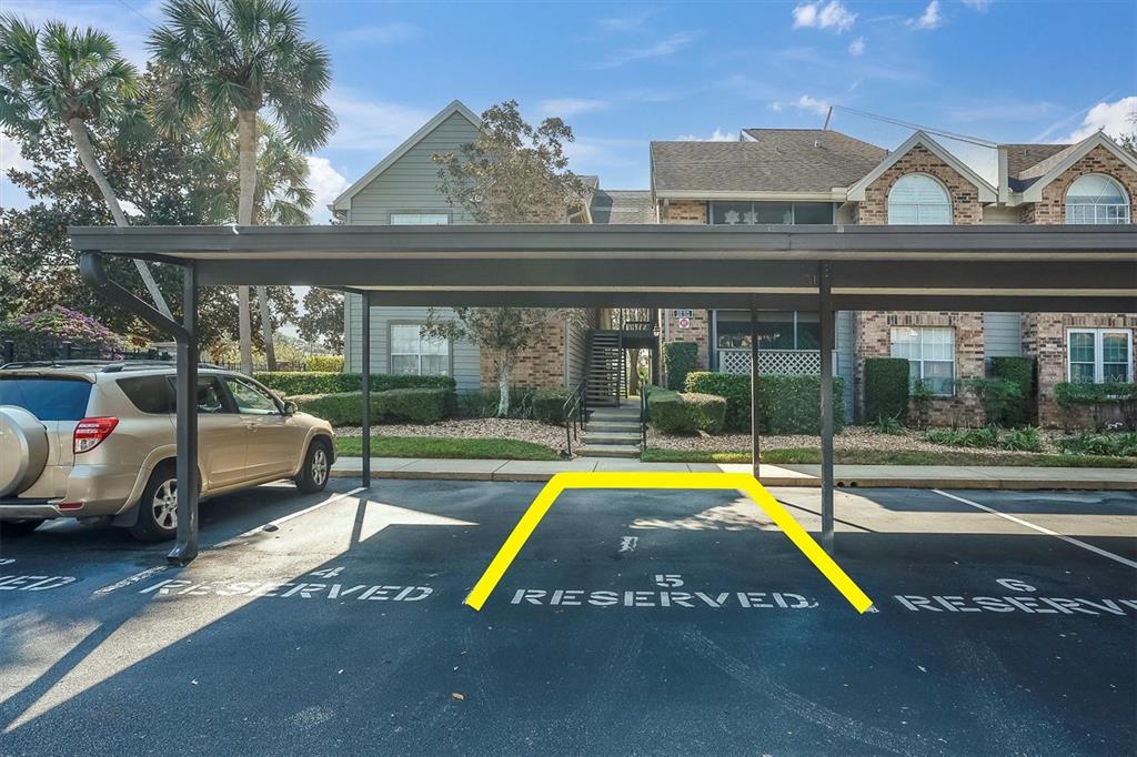 2500 Winding Creek Boulevard, Unit A104 Clearwater, FL 33761 - Photo 25 of 31 a view of swimming pool with a lounge chair and table